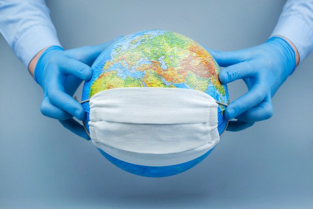 Dünyada koronavirusla bağlı son vəziyyət 1616956756 hands medical gloves put protective mask globe world coronavirus corona virus attack concept concept fight against virus 168508 455.jpg